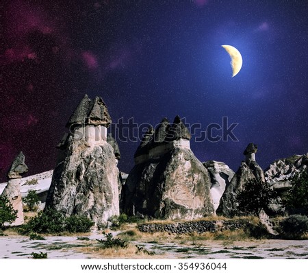 Volcanic rock formations of Cappadocia under the starry sky and the Moonlight, Turkey
