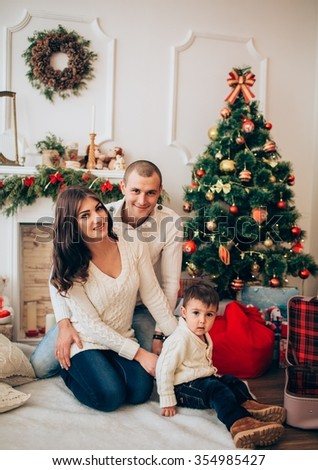 Beautiful family with son waiting for Christmas