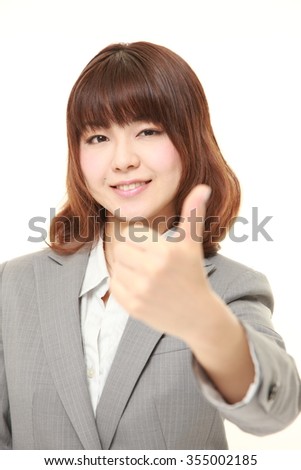businesswoman with thumbs up gesture