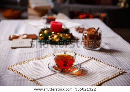 christmas stuff. shot made with shallow depth of field. selective focus. a cup of tea.
