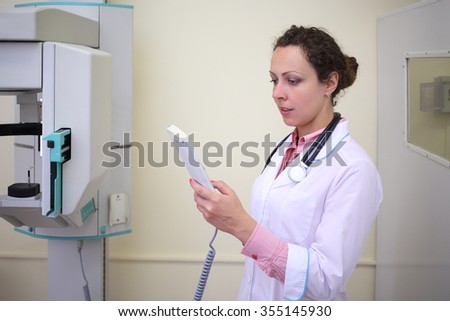 Medical worker uses orthopantomograph in the examination of the patient