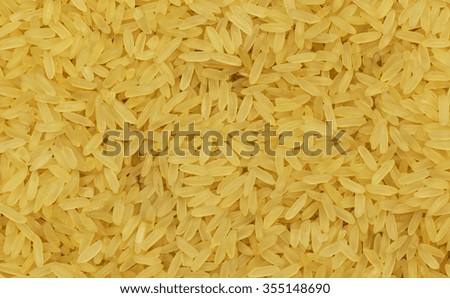 Close up of yellow rice still waiting for the preparation.