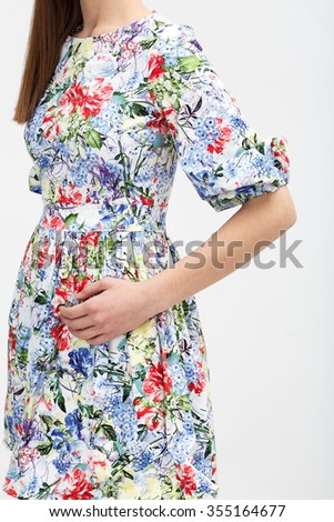 Girl in color summer dress on the white background
