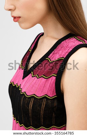 Girl in color summer dress on the white background