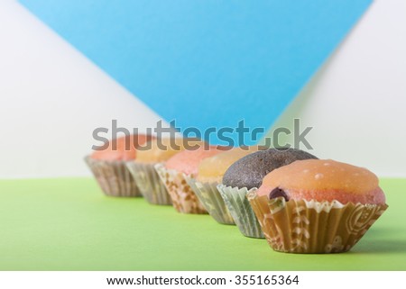 Homemade cupcakes on a colored background. Selective focus.
