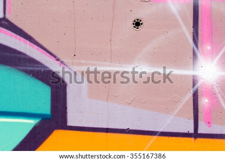 typography and color lines, segment of an urban grafitti on wall