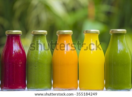 Organic cold-pressed raw vegetable juices in glass bottles Royalty-Free Stock Photo #355184249