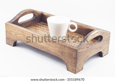 Coffee cup on wooden tray isolated on white background, stock photo