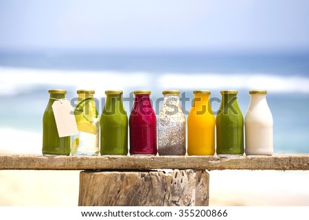Organic cold-pressed raw vegetable juices in glass bottles Royalty-Free Stock Photo #355200866