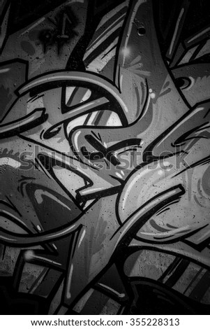 black ink grafitti design in city wall, street art segment