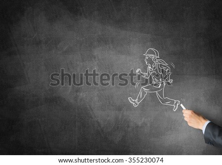 Male hand drawing with chalk engineer woman on blackboard