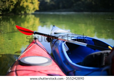 Colorful kayaks on the tropical beach Royalty-Free Stock Photo #355242890