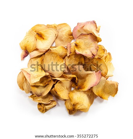 Heap of dry yellow rose petals isolated on white background