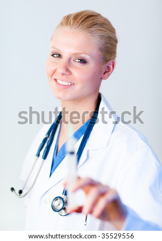 Young female Doctor holding a needle