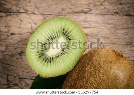 Kiwi fruit on brown wooden background. Close up