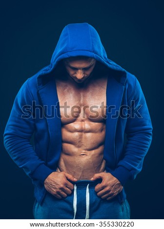 Man with muscular torso. Strong Athletic Man Fitness Model Torso showing six pack abs