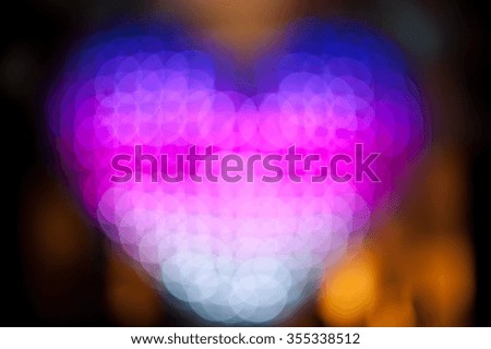 Abstract heart shaped bokeh background of colorful Christmas lights