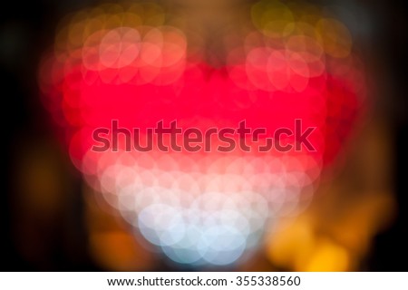 Abstract heart shaped bokeh background of colorful Christmas lights