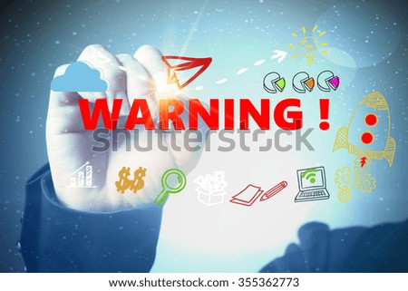 business hand writing WARNING  with social media icon , business concept , business idea