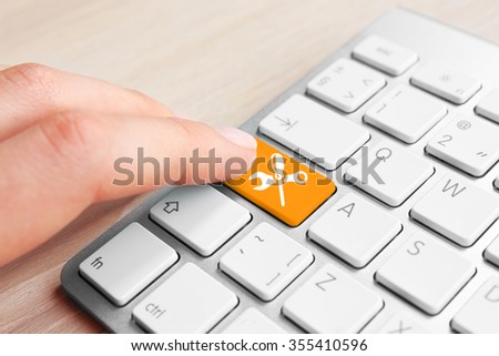 Close-up of laptop keyboard with color button and instruments image on it