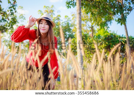 Outdoor portrait of young woman sunlight