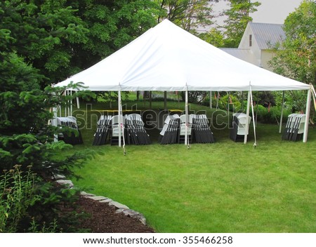 informal events tent in the backyard Royalty-Free Stock Photo #355466258