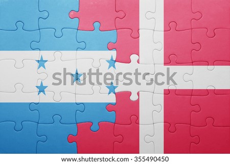 puzzle with the national flag of honduras and denmark . concept