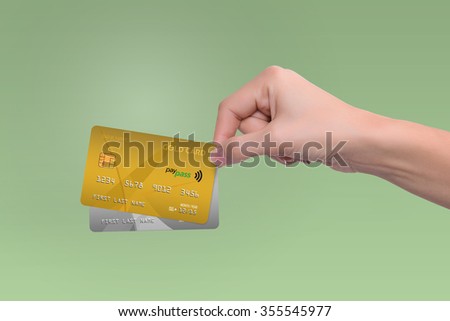 Isolated gold and gray credit cards in woman hand