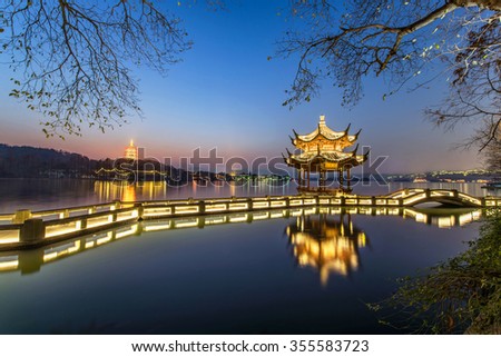 beautiful hangzhou in twilight and ancient pavilion Royalty-Free Stock Photo #355583723