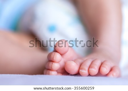 baby toes on the bed