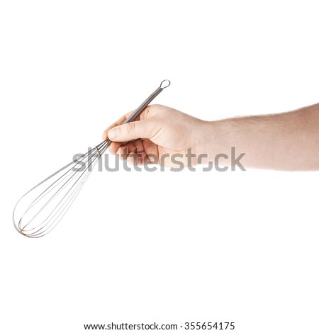 Caucasian male hand holding a egg beater mixer whisk, composition isolated over the white background