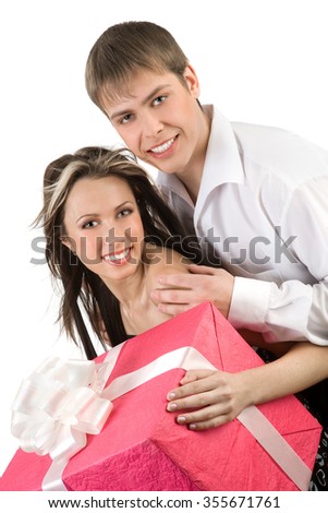 Happy Young Smiling Man and Woman Holding big  Present.