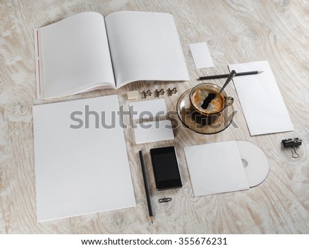 Photo of blank stationery set on light wooden background. Template for branding identity.