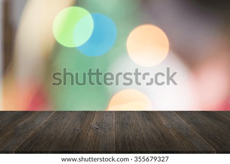 Wood terrace and Blurred of Abstract bokeh background of Christmas tree decoration for merry christmas Xmas and happy new year