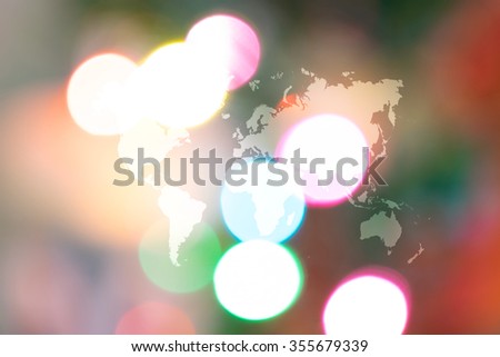Abstract bokeh background of Christmas tree decoration for merry christmas Xmas and happy new year with world map (Outline elements of world map image from NASA public domain)