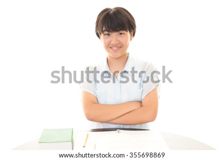 Teen girl studying at the desk