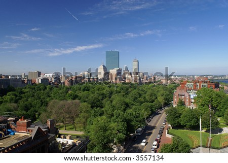 early morning in boston massachusetts on a lush spring morning, showing boston common and the back bay of copley square and the skyline beyond becon street