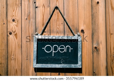 Vintage open sign on wooden door