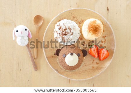 Chocolate Mousse Cakes, Chocolate teddy bear with ice cream and berries, on Wooden table, Selective Focus