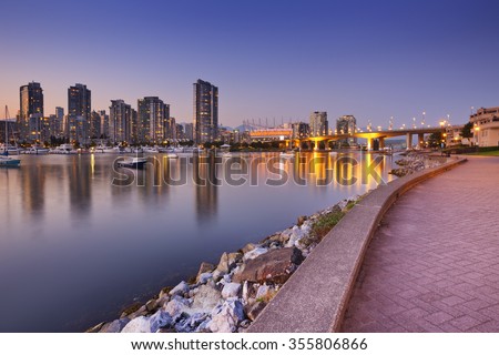 The skyline of Vancouver, British Columbia, Canada from across the water at dusk.