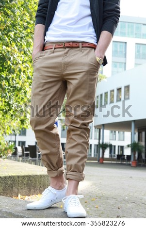 man with chinos, chino pants Royalty-Free Stock Photo #355823276