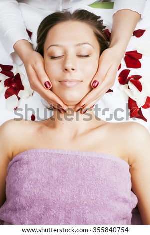 stock photo attractive lady getting spa treatment in salon, massage doctor smiling care