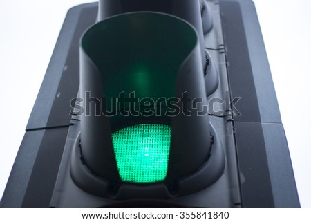 Green man go road traffic light sign.