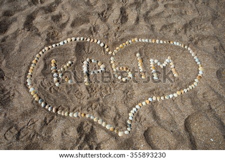 The inscription of the Crimea shells on the sand in the form of heart