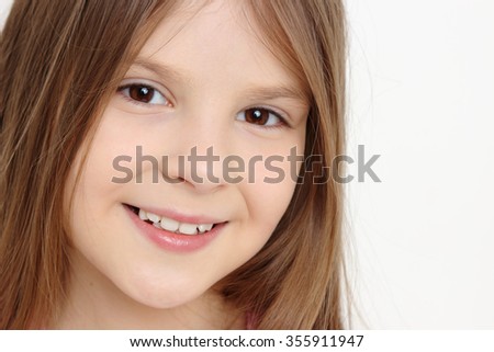 Beautiful little girl with gorgeous and healthy hair