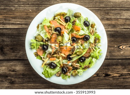 Mediterranean salad with salmon and olives.