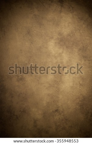 Painted canvas or muslin fabric cloth studio backdrop or background, suitable for use with portraits, products and concepts. Medium brown with warm tones. Royalty-Free Stock Photo #355948553