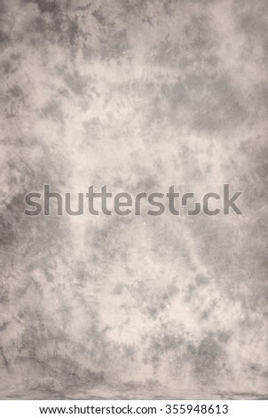 Painted canvas or muslin fabric cloth studio backdrop or background, suitable for use with portraits, products and concepts. A neutral palette of ecru,brown and gray. Royalty-Free Stock Photo #355948613