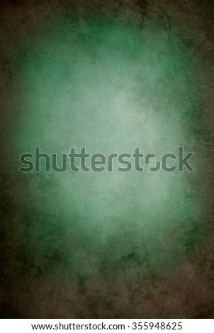 Painted canvas or muslin fabric cloth studio backdrop or background, suitable for use with portraits, products and concepts. Green and brown with lighter shaded center spot. Royalty-Free Stock Photo #355948625