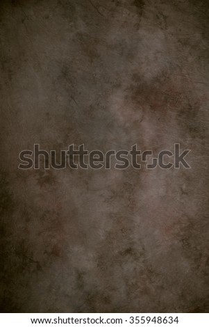 Painted canvas or muslin fabric cloth studio backdrop or background, suitable for use with portraits, products and concepts. Brown with subtle hints of red. Royalty-Free Stock Photo #355948634